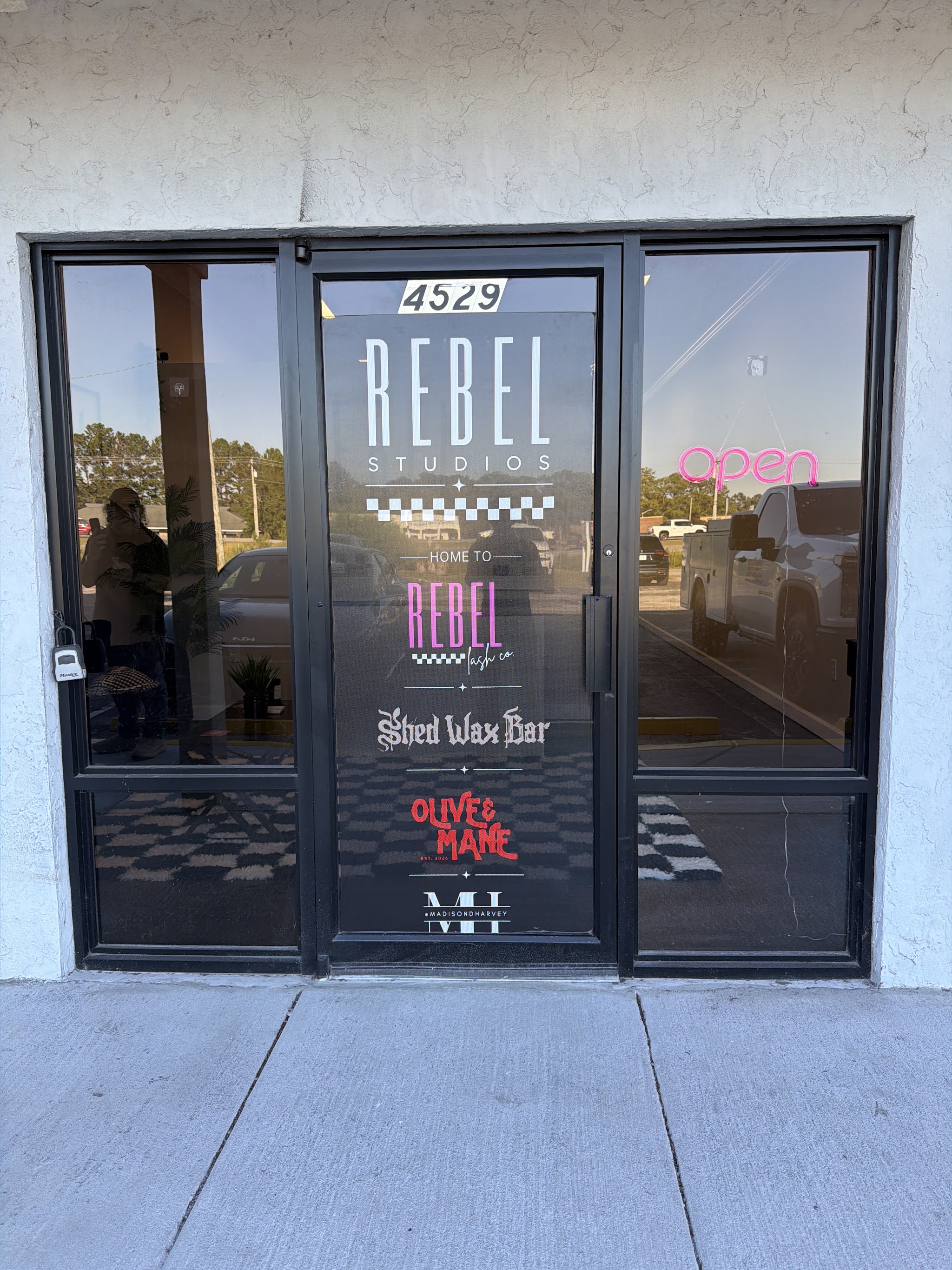 The door at 4529 US Highway 17 Bypass South with the Rebel Studios sign